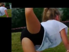 Красивые девушки в трусиках занимаются спортом в купальниках на траве